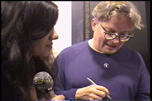 Mark Mothersbaugh of Devo about to sign for Ms Divine